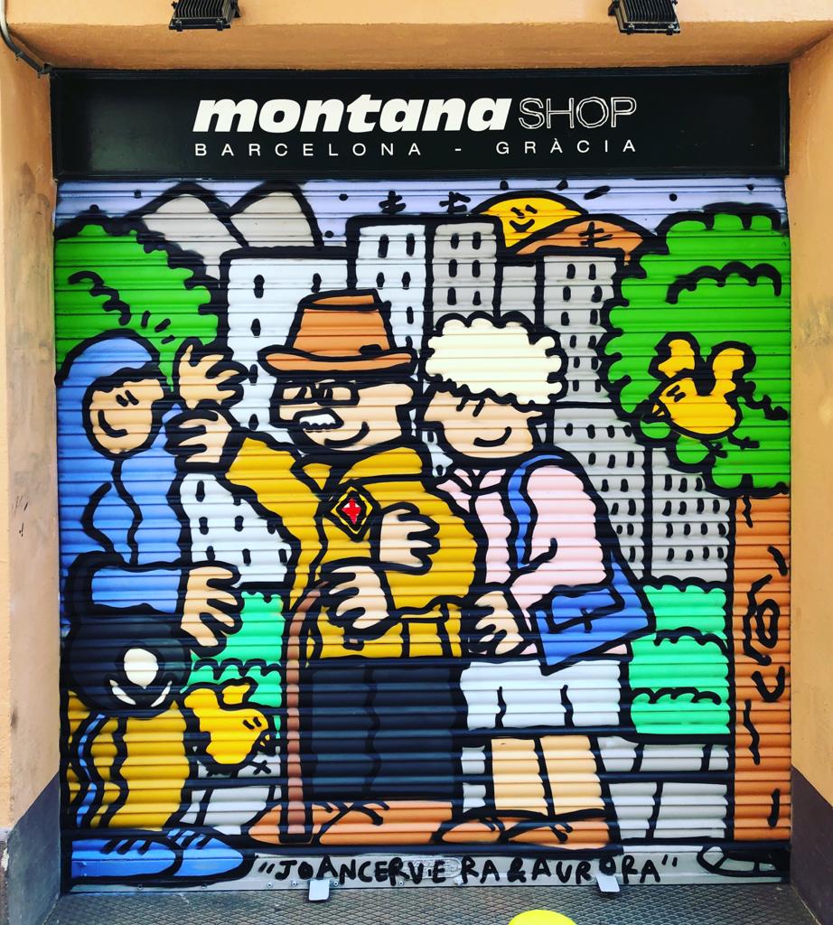 Mural artístic a la persiana d'una botiga Montana, elaborat per Kamil / Montana